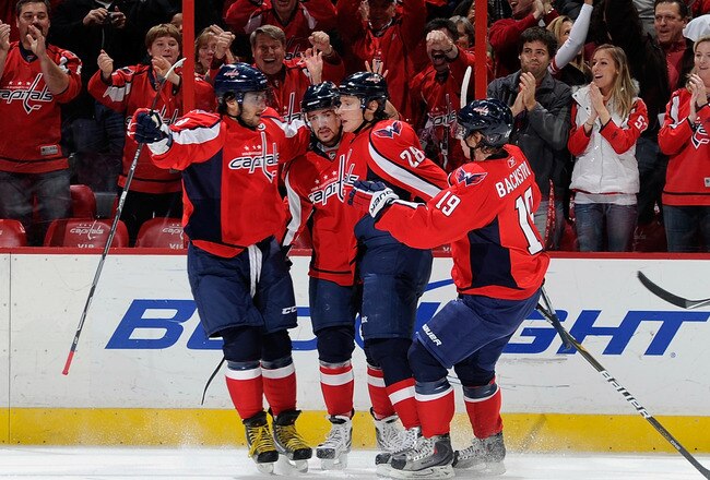 WASHINGTON - NOVEMBER 28:  Alexander Semin #28 of the Washington Capitals celebrates with Alex Ovechkin #8, Mike Green #52 and Nicklas Backstrom #19 after scoring in the first period against the Carolina Hurricanes at the Verizon Center on November 28, 2010 in Washington, DC.  (Photo by Greg Fiume/Getty Images)