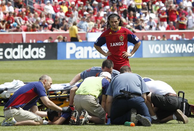 SANDY, UT - MAY 7: Fabian Espindola #7 of Real Salt Lake watches over his teammate Javier Morales #11 as he is attended to by medical personal during a game against Chivas USA during the first half of an MLS soccer game May 7, 2011 at Rio Tinto Stadium in Sandy, Utah. Morales was taken to the hospital where is was determined he had a broken and dislocated ankle. Real Beat Chivas 1-0. (Photo by George Frey/Getty Images)