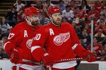 DETROIT - MAY 10: Pavel Datsyuk #13 and Henrik Zetterberg #40 of the Detroit Red Wings talk during the second period while playing the San Jose Sharks in Game Six of the Western Conference Semifinals during the 2011 NHL Stanley Cup Playoffs on May 10, 2011 at Joe Louis Arena in Detroit, Michigan. (Photo by Gregory Shamus/Getty Images)