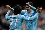 MANCHESTER, ENGLAND - APRIL 03:  David Silva of Manchester City celebrates scoring his team's third goal with team mate Adam Johnson (R) during the Barclays Premier League match between Manchester City and Sunderland at the City of Manchester Stadium on April 3, 2011 in Manchester, England.  (Photo by Laurence Griffiths/Getty Images)