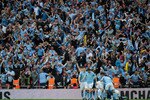 LONDON, ENGLAND - APRIL 16: The City fans celebrate after Yaya Toure of Manchester City scored the opening goal during the FA Cup sponsored by E.ON semi final match between Manchester City and Manchester United at Wembley Stadium on April 16, 2011 in London, England.  (Photo by Jamie McDonald/Getty Images)
