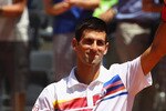 ROME, ITALY - MAY 11:  Novak Djokovic of Serbia waves to the crowd after his second round victory against Lukasz Kubot of Poland during day four of the Internazoinali BNL D'Italia at the Foro Italico Tennis Centre on May 11, 2011 in Rome, Italy.  (Photo by Clive Brunskill/Getty Images)