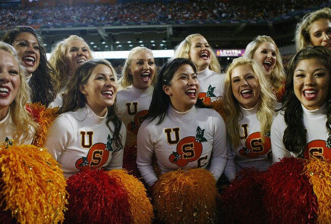 MIAMI - JANUARY 4:  Trojan cheerleaders support the USC Trojans as they face the Oklahoma Sooners in the 2005 FedEx Orange Bowl National Championship on January 4, 2005 at Pro Player Stadium in Miami, Florida. USC defeated Oklahoma 55-19. (Photo by Doug Pensinger/Getty Images)