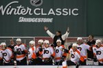 BOSTON - JANUARY 01:  Peter Laviolette, head coach of the Philadelphia Flyers, reacts during the game against the Boston Bruins during the 2010 Bridgestone Winter Classic at Fenway Park on January 1, 2010 in Boston, Massachusetts. The Boston Bruins defeated the Philadelphia Flyers 2-1 in overtime.  (Photo by Elsa/Getty Images)