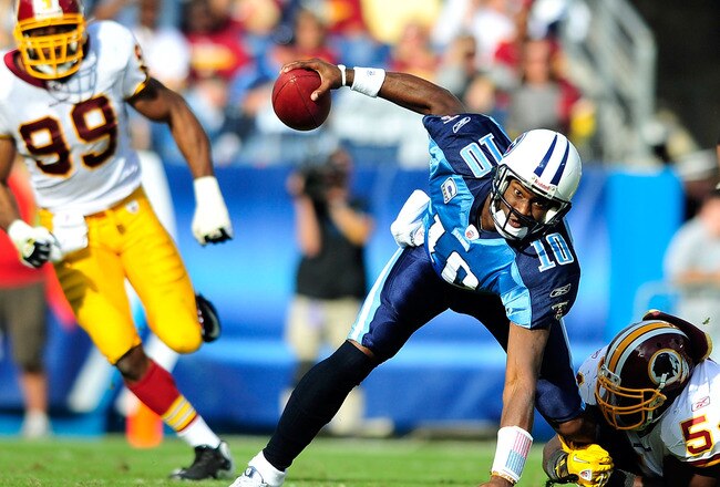NASHVILLE, TN - NOVEMBER 21:  Quarterback Vince Young #10 of the Tennessee Titans scrambles away from H.B. Blades #54 of the Washington Redskins at LP Field on November 21, 2010 in Nashville, Tennessee. The Redskins won 19-16 in overtime.  (Photo by Grant Halverson/Getty Images)