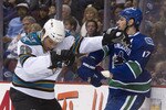 VANCOUVER, CANADA - JANUARY 20: Ryan Kesler #17 of the Vancouver Canucks and Derek Joslin #65 of the San Jose Sharks push and shove behind the play during the second period in NHL action on January 20, 2011 at Rogers Arena in Vancouver, BC, Canada.  (Photo by Rich Lam/Getty Images)