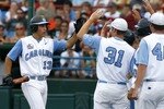 OMAHA, NE - JUNE 21:  First baseman Dustin Ackley #13 of the North Carolina Tar Heels celebrates with teammates after hitting a solo homer in the second inning to the give the Tar Heels a 1-0 lead over the Rice Owls in Game 13 of the NCAA College World Series at Rosenblatt Stadium on June 21, 2007 in Omaha, Nebraska. (Photo by Kevin C. Cox/Getty Images)