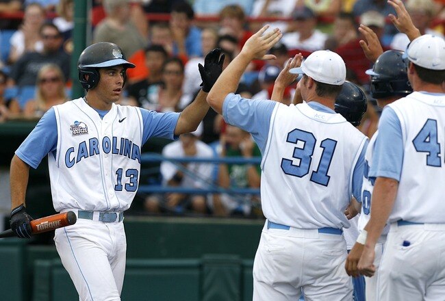 OMAHA, NE - JUNE 21:  First baseman Dustin Ackley #13 of the North Carolina Tar Heels celebrates with teammates after hitting a solo homer in the second inning to the give the Tar Heels a 1-0 lead over the Rice Owls in Game 13 of the NCAA College World Series at Rosenblatt Stadium on June 21, 2007 in Omaha, Nebraska. (Photo by Kevin C. Cox/Getty Images)