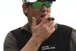 MELBOURNE, AUSTRALIA - NOVEMBER 10:  Shane Warne of Australia smokes a cigar during the Pro-Am ahead of the Australian Masters at The Victoria Golf Club on November 10, 2010 in Melbourne, Australia.  (Photo by Lucas Dawson/Getty Images)