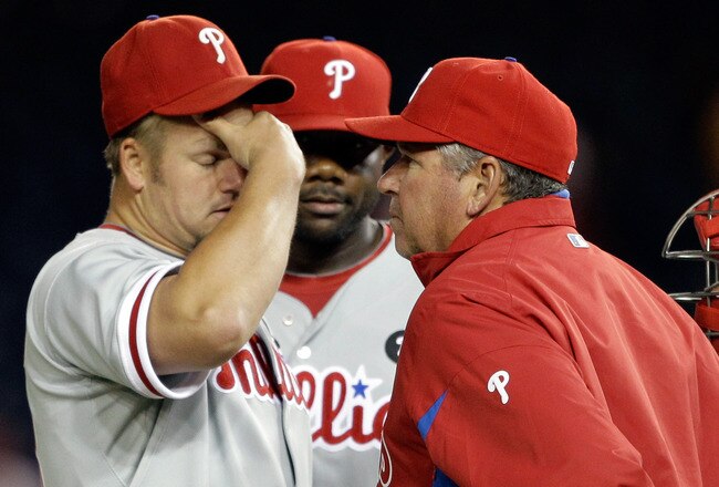 WASHINGTON, DC - APRIL 12:  Starting pitcher Joe Blanton #56 of the Philadelphia Phillies (L) talks with pitching coach Rich Dubee (R) during the fourth inning against the Washington Nationals at Nationals Park on April 12, 2011 in Washington, DC.  (Photo by Rob Carr/Getty Images)