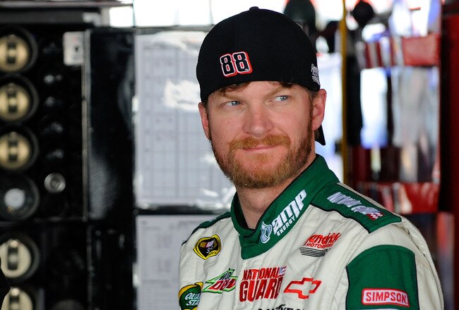 DOVER, DE - MAY 13:  Dale Earnhardt Jr., driver of the #88 Amp Energy Sugar Free/National Guard Chevrolet, stands in the garage during practice for the NASCAR Sprint Cup Series FedEx 400 Benefiting Autism Speaks at Dover International Speedway on May 13, 2011 in Dover, Delaware.  (Photo by Jared C. Tilton/Getty Images for NASCAR)
