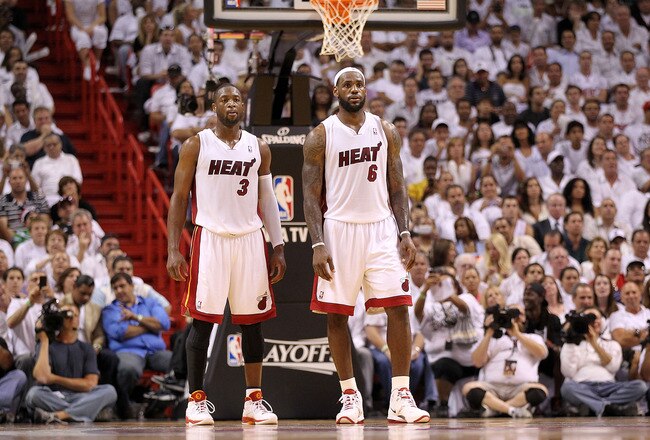 MIAMI, FL - APRIL 27:  Dwyane Wade #3 and LeBron James #6 of the Miami Heat talk during game five of the Eastern Conference Quarterfinals in the 2011 NBA Playoffs against the Philadelphia 76ers at American Airlines Arena on April 27, 2011 in Miami, Florida. NOTE TO USER: User expressly acknowledges and agrees that, by downloading and/or using this Photograph, User is consenting to the terms and conditions of the Getty Images License Agreement.  (Photo by Mike Ehrmann/Getty Images)