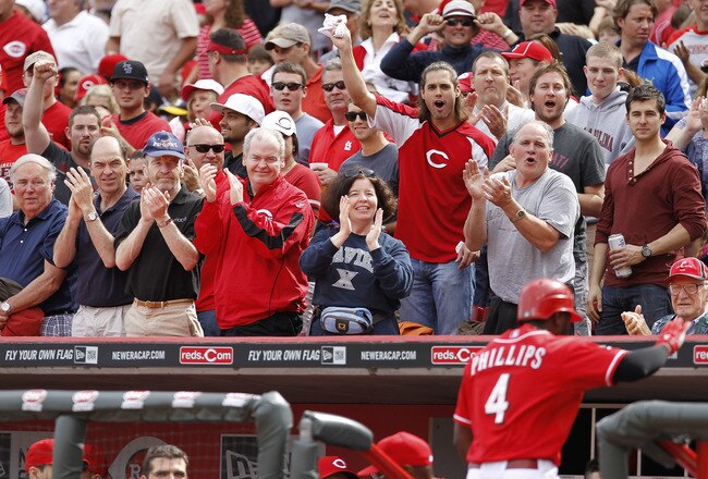 CINCINNATI, OH - MAY 14: Fans cheer as Brandon Phillips #4 of the Cincinnati Reds returns to the dugout after hitting a home run in the second inning against the St. Louis Cardinals at Great American Ball Park on May 14, 2011 in Cincinnati, Ohio. The Reds defeated the Cardinals 7-3. (Photo by Joe Robbins/Getty Images)