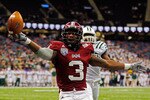 NEW ORLEANS, LA - DECEMBER 18:  Jerrel Jernigan #3 of the Troy University Trojans scores a touchdown over Donovan Fletcher #29 of the Ohio University Bobcats during the R&L Carriers New Orleans Bowl at the Louisiana Superdome on December 18, 2010 in New Orleans, Louisiana.  (Photo by Chris Graythen/Getty Images)