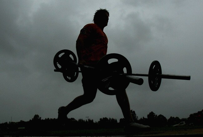 SYDNEY, AUSTRALIA - JANUARY 18: Chris Lawrence of the Tigers carries barbells during the Wests Tigers Strongman Challenge held at Concord Oval January 18, 2008 in Sydney, Australia.  (Photo by Mark Nolan/Getty Images)