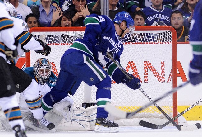 VANCOUVER, BC - MAY 15:  Henrik Sedin #33 of the Vancouver Canucks backhands the puck for his third period goal against goaltender Antti Niemi #31 of the San Jose Sharks in the third period in Game One of the Western Conference Finals during the 2011 Stanley Cup Playoffs at Rogers Arena on May 15, 2011 in Vancouver, British Columbia, Canada. The Canucks defeated the Sharks 3-2.  (Photo by Harry How/Getty Images)