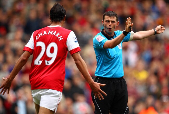 LONDON, ENGLAND - MAY 15:  Marouane Chamakh of Arsenal argues with referee Michael Oliver during the Barclays Premier League match between Arsenal and Aston Villa at the Emirates Stadium on May 15, 2011 in London, England.  (Photo by Richard Heathcote/Getty Images)
