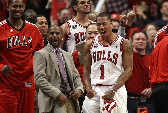 CHICAGO, IL - MAY 15:  (L-R) Kurt Thomas #40, John Lucas III, Joakim Noah #13 and Derrick Rose #1 of the Chicago Bulls celebrate late in the fourth quarter against the Miami Heat in Game One of the Eastern Conference Finals during the 2011 NBA Playoffs on May 15, 2011 at the United Center in Chicago, Illinois. The Bulls won 103-82. NOTE TO USER: User expressly acknowledges and agrees that, by downloading and or using this photograph, User is consenting to the terms and conditions of the Getty Images License Agreement  (Photo by Jonathan Daniel/Getty Images)