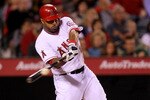 ANAHEIM, CA - MAY 7:   Vernon Wells #10 of the Los Angeles Angels of Anaheim picks up an RBI in the sixth inning with a sacrifice fly against the Cleveland Indians on May 7, 2011 at Angel Stadium in Anaheim, California.    (Photo by Stephen Dunn/Getty Images)