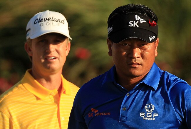 PONTE VEDRA BEACH, FL - MAY 15:  K.J. Choi of South Korea (R) and David Toms (L) look on from the 18th tee box during the final round of THE PLAYERS Championship held at THE PLAYERS Stadium course at TPC Sawgrass on May 15, 2011 in Ponte Vedra Beach, Florida.  (Photo by Streeter Lecka/Getty Images)
