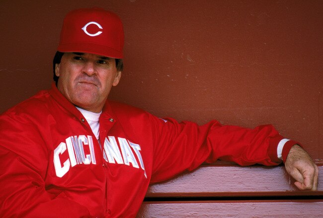 SAN FRANCISCO - 1989:  Manager Pete Rose #14 of the Cincinnati Reds sits in the dugout during the game against the San Francisco Giants at Candlestick Park during the 1989 MLB season in San Francisco, California.  (Photo by Otto Greule Jr./Getty Images)