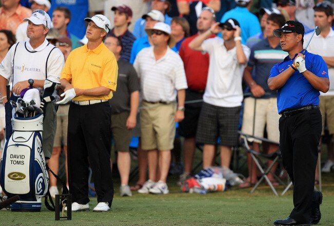 PONTE VEDRA BEACH, FL - MAY 15:  K.J. Choi of South Korea hits his tee shot on the first playoff hole as David Toms looks on during the final round of THE PLAYERS Championship held at THE PLAYERS Stadium course at TPC Sawgrass on May 15, 2011 in Ponte Vedra Beach, Florida.  (Photo by Streeter Lecka/Getty Images)