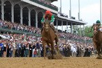 LOUISVILLE, KY - MAY 07:  Jockey John Velazquez, riding Animal Kingdom #16 crosses the finish line on way to winning the 137th Kentucky Derby at Churchill Downs on May 7, 2011 in Louisville, Kentucky.  (Photo by Matthew Stockman/Getty Images)