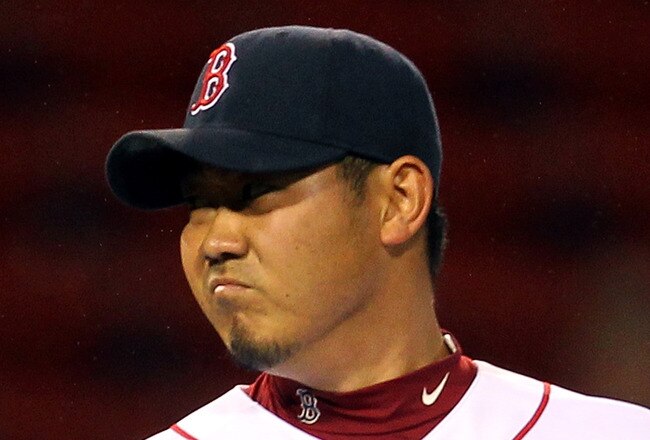 BOSTON, MA - MAY 04:  Daisuke Matsuzaka #18 of the Boston Red Sox reacts after giving up a single to Peter Bourjos #25 of the Los Angeles Angels of Anaheim in the 13th inning at Fenway Park on May 4, 2011 in Boston, Massachusetts. (Photo by Jim Rogash/Getty Images)
