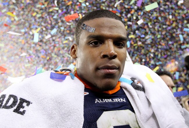 GLENDALE, AZ - JANUARY 10:  Quarterback Cameron Newton #2 of the Auburn Tigers celebrates the Tigers 22-19 victory against the Oregon Ducks in the Tostitos BCS National Championship Game at University of Phoenix Stadium on January 10, 2011 in Glendale, Arizona.  (Photo by Christian Petersen/Getty Images)