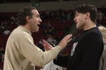 SEATTLE - FEBRUARY 12:  Owner Mark Cuban of the Dallas Mavericks talks with owner Howard Schultz of the Seattle SuperSonics before the game at Key Arena in Seattle, Washington on February 12, 2002.  The Mavericks won 112-106.  NOTE TO USER: User expressly acknowledges and agrees that, by downloading and/or using this Photograph, User is consenting to the terms and conditions of the Getty Images License Agreement Mandatory Copyright Notice:  Copyright 2002 (Photo by Otto Greule/Getty Images)