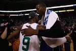 BOSTON - MAY 28:  Dwight Howard #12 of the Orlando Magic congratulates Rajon Rondo #9 of the Boston Celtics after the Celtics won 96-84 in Game Six of the Eastern Conference Finals during the 2010 NBA Playoffs at TD Garden on May 28, 2010 in Boston, Massachusetts.  NOTE TO USER: User expressly acknowledges and agrees that, by downloading and/or using this Photograph, user is consenting to the terms and conditions of the Getty Images License Agreement.  (Photo by Chris Chambers/Getty Images)