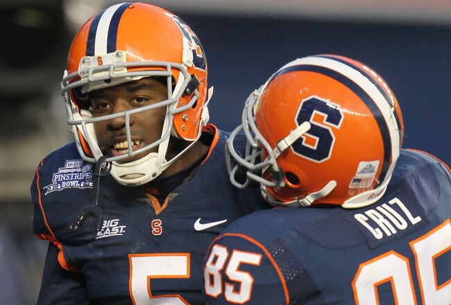 NEW YORK, NY - DECEMBER 30: Marcus Sales #5 of the Syracuse Orange is congratulated by team mate Jose Cruz #85 after scoring a touchdown against  the Kansas State Wildcats during the New Era Pinstripe Bowl at Yankee Stadium on December 30, 2010 in New York, New York.  (Photo by Chris McGrath/Getty Images)
