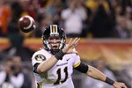 TEMPE, AZ - DECEMBER 28:  Quarterback Blaine Gabbert #11 of the Missouri Tigers flips the ball during the Insight Bowl against the Iowa Hawkeyes at Sun Devil Stadium on December 28, 2010 in Tempe, Arizona.  (Photo by Christian Petersen/Getty Images)