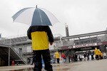 INDIANAPOLIS, IN - MAY 15:  Safety guards patrol the famed Gasoline Alley as rain interupts the first day of practice for the Indianapolis 500 at Indianapolis Motor Speedway on May 15, 2011 in Indianapolis, Indiana.  (Photo by Matthew Stockman/Getty Images)