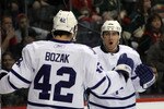ST PAUL, MN - MARCH 22: Tyler Bozak #42 of the Toronto Maple Leafs congratulates Joffrey Lupul #19 on his first period goal against the Minnesota Wild  at the Xcel Energy Center on March 22, 2011 in St Paul, Minnesota. (Photo by Bruce Bennett/Getty Images)