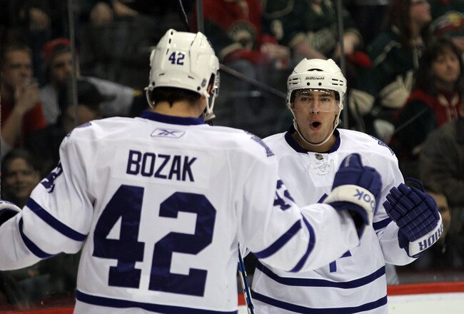 ST PAUL, MN - MARCH 22: Tyler Bozak #42 of the Toronto Maple Leafs congratulates Joffrey Lupul #19 on his first period goal against the Minnesota Wild  at the Xcel Energy Center on March 22, 2011 in St Paul, Minnesota. (Photo by Bruce Bennett/Getty Images)