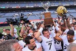 DENVER - SEPTEMBER 04:  Quarterback Cody Hawkins #7 of the Colorado Buffaloes hoists the Centenial Trophy after defeating the Colorado State Rams in the Rocky Mountain Showdown at INVESCO Field at Mile High on September 4, 2010 in Denver, Colorado. Colorado was awarded the Centenial Trophy after they defeated Colorado State 24-3.  (Photo by Doug Pensinger/Getty Images)