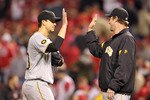 CINCINNATI, OH - MAY 18:  Charlie Morton #50 of the Pittsburgh Pirates is congratulated after pitching a 5 hit complete game shutout against the Cincinnati Reds at Great American Ball Park on May 18, 2011 in Cincinnati, Ohio.  The Pirates won 5-0.  (Photo by Andy Lyons/Getty Images)