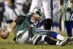 PHILADELPHIA, PA - JANUARY 02:  Kevin Kolb #4 of the Philadelphia Eagles is sacked by DeMarcus Ware #94 of the Dallas Cowboys on January 2, 2011 at Lincoln Financial Field in Philadelphia, Pennsylvania. The Cowboys defeated the Eagles 14-13.  (Photo by Jim McIsaac/Getty Images)