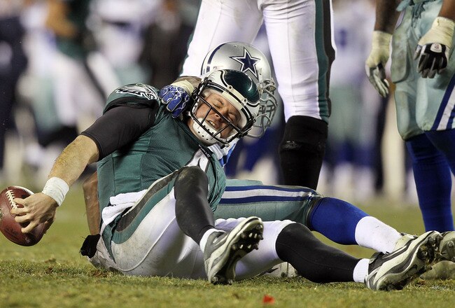 PHILADELPHIA, PA - JANUARY 02:  Kevin Kolb #4 of the Philadelphia Eagles is sacked by DeMarcus Ware #94 of the Dallas Cowboys on January 2, 2011 at Lincoln Financial Field in Philadelphia, Pennsylvania. The Cowboys defeated the Eagles 14-13.  (Photo by Jim McIsaac/Getty Images)