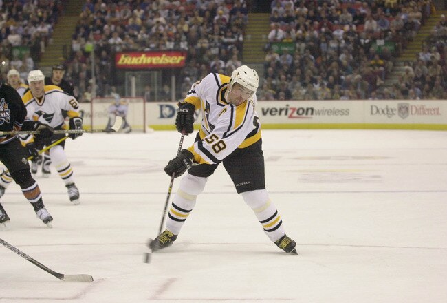 18 Apr 2001 : Jaromir Jagr of the Pittsburgh Penguins passes the puck during Game 4 of the Eastern Conference Quarterfinals against the Washington Capitals at the Mellon Arena in Pittsburgh, Pennsylvania.The Capitals tie the series at two games each with a 4-3 overtime win against the Penguins.DIGITAL IMAGE.Mandatory Credit: Doug Pensinger/ALLSPORT