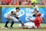 CINCINNATI, OH - MAY 19:  Ronny Cedeno #5 of the Pittsburgh Pirates tags out Brandon Phillips #4 of the Cincinnati Reds while he attempted to steal second base during the game at Great American Ball Park on May 19, 2011 in Cincinnati, Ohio.  (Photo by Andy Lyons/Getty Images)