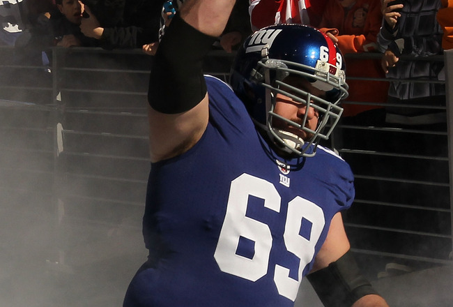 EAST RUTHERFORD, NJ - NOVEMBER 28:  Rich Seubert #69 of the New York Giants is introduced before the game against the Jacksonville Jaguars  on November 28, 2010 at The New Meadowlands Stadium in East Rutherford, New Jersey.  (Photo by Al Bello/Getty Images)