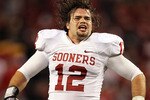 ARLINGTON, TX - DECEMBER 04:  Linebacker Austin Box #12 of the Oklahoma Sooners celebrates a 23-20 win against the Nebraska Cornhuskers during the Big 12 Championship at Cowboys Stadium on December 4, 2010 in Arlington, Texas.  (Photo by Ronald Martinez/Getty Images)