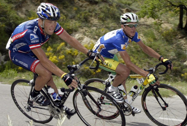 SISTERON, FRANCE:  US Lance Armstrong (L) rides close to compatriot Tyler Hamilton (Team Phonak) (R) during the fifth stage of the '56th Criterium du Dauphine Libere', between Bollene and Sisteron, 11 June 2004. Australian Stuart O'Grady (Team Cofidis/Fra) won the stage prior to US George Hincapie (Team US Postal) and compatriot Baden Cooke (FDJeux.com/Fra) Spanish Iban Mayo (Team Euskatel/Spa) remains the overall leader. AFP PHOTO DAMIEN MEYER  (Photo credit should read DAMIEN MEYER/AFP/Getty Images)