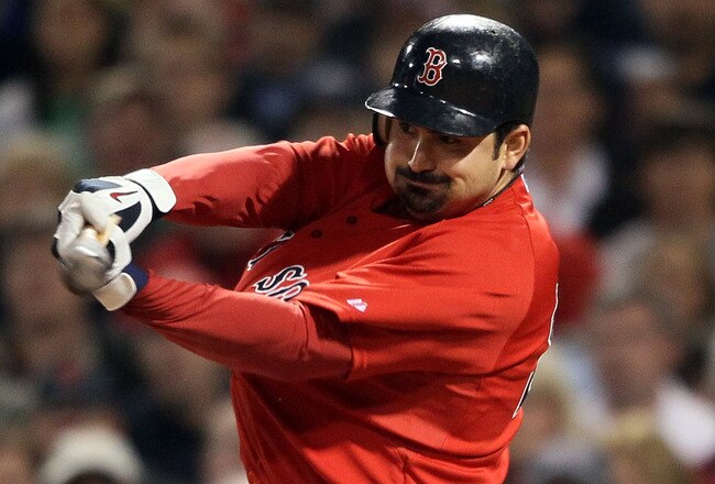 BOSTON, MA - MAY 20:  Adrian Gonzalez #28 of the Boston Red Sox hits a 2RBI single in the fourth inning against the Chicago Cubs on May 20, 2011 at Fenway Park in Boston, Massachusetts.on May 20, 2011 at Fenway Park in Boston, Massachusetts. The Chicago Cubs and the Boston Red Sox have not played at Fenway Park since the 1918 World Series.  (Photo by Elsa/Getty Images)