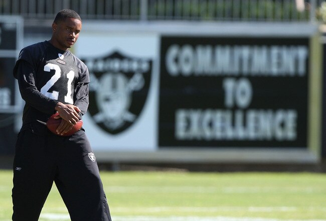 NAPA, CA - AUGUST 05:  Nnamdi Asomugha #21 looks on during the Oakland Raiders Training Camp at the Napa Valley Marriott on August 5, 2009 in Napa, California.  (Photo by Jed Jacobsohn/Getty Images)
