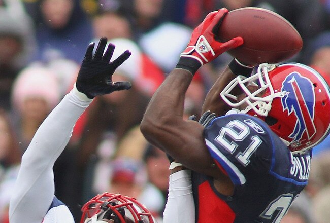 ORCHARD PARK, NY - DECEMBER 26:  C.J. Spiller #21  of the Buffalo Bills makes a catch against Kyle Arrington #27 of the New England Patriots at Ralph Wilson Stadium on December 26, 2010 in Orchard Park, New York. New England won 34-3. (Photo by Rick Stewart/Getty Images)
