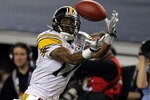 ARLINGTON, TX - FEBRUARY 06:  Mike Wallace #17 of the Pittsburgh Steelers catches a 25-yard touchdown reception in the fourth quarter against the Green Bay Packers during Super Bowl XLV at Cowboys Stadium on February 6, 2011 in Arlington, Texas. Packers won 31-25. (Photo by Al Bello/Getty Images)