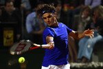 ROME, ITALY - MAY 11:  Roger Federer of Switzerland plays a forehand during his second round match against Jo-Wilfried Tsonga of France during day four of the Internazoinali BNL D'Italia at the Foro Italico Tennis Centre on May 11, 2011 in Rome, Italy.  (Photo by Clive Brunskill/Getty Images)